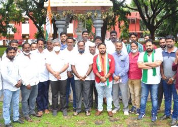 Congress silent lying in front of Gandhi statue to condemn killing of farmers