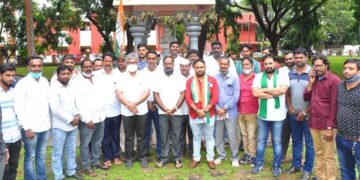 Congress silent lying in front of Gandhi statue to condemn killing of farmers