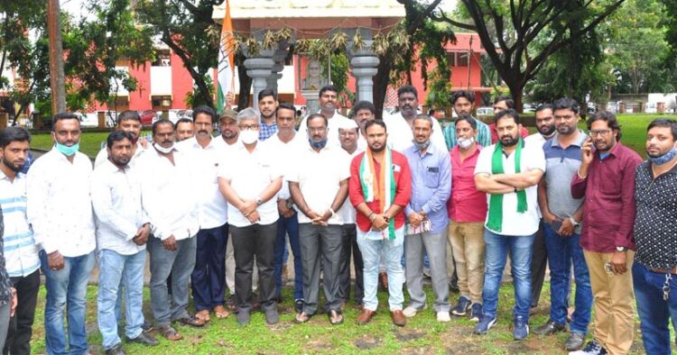 Congress silent lying in front of Gandhi statue to condemn killing of farmers