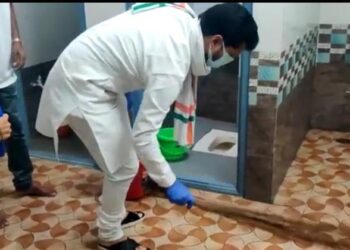 BJP national general secretary C T Ravi holds broom and cleans toilet