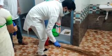 BJP national general secretary C T Ravi holds broom and cleans toilet