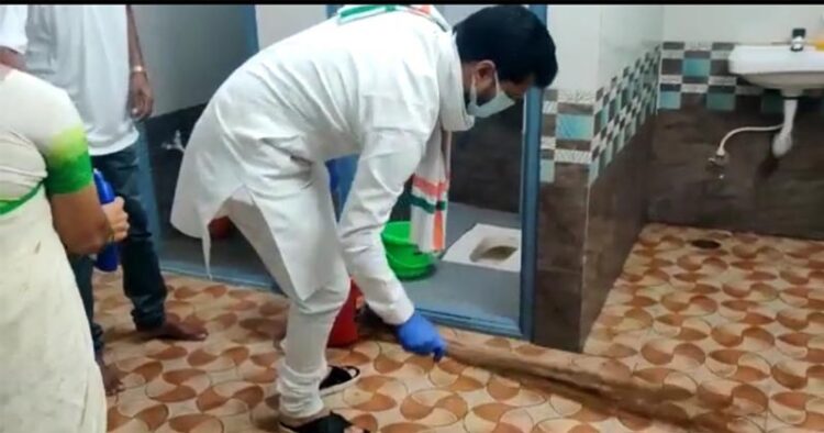 BJP national general secretary C T Ravi holds broom and cleans toilet